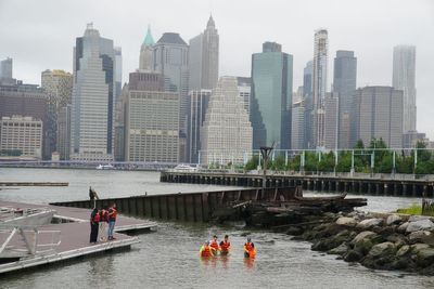 William wades into New York river to learn about oyster reef project