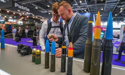 ‘War is back. People want to stock up’: inside Europe’s biggest arms fair