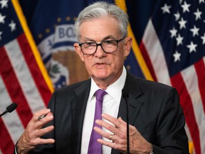 The Federal Reserve holds interest rates steady but hints at more action this year
