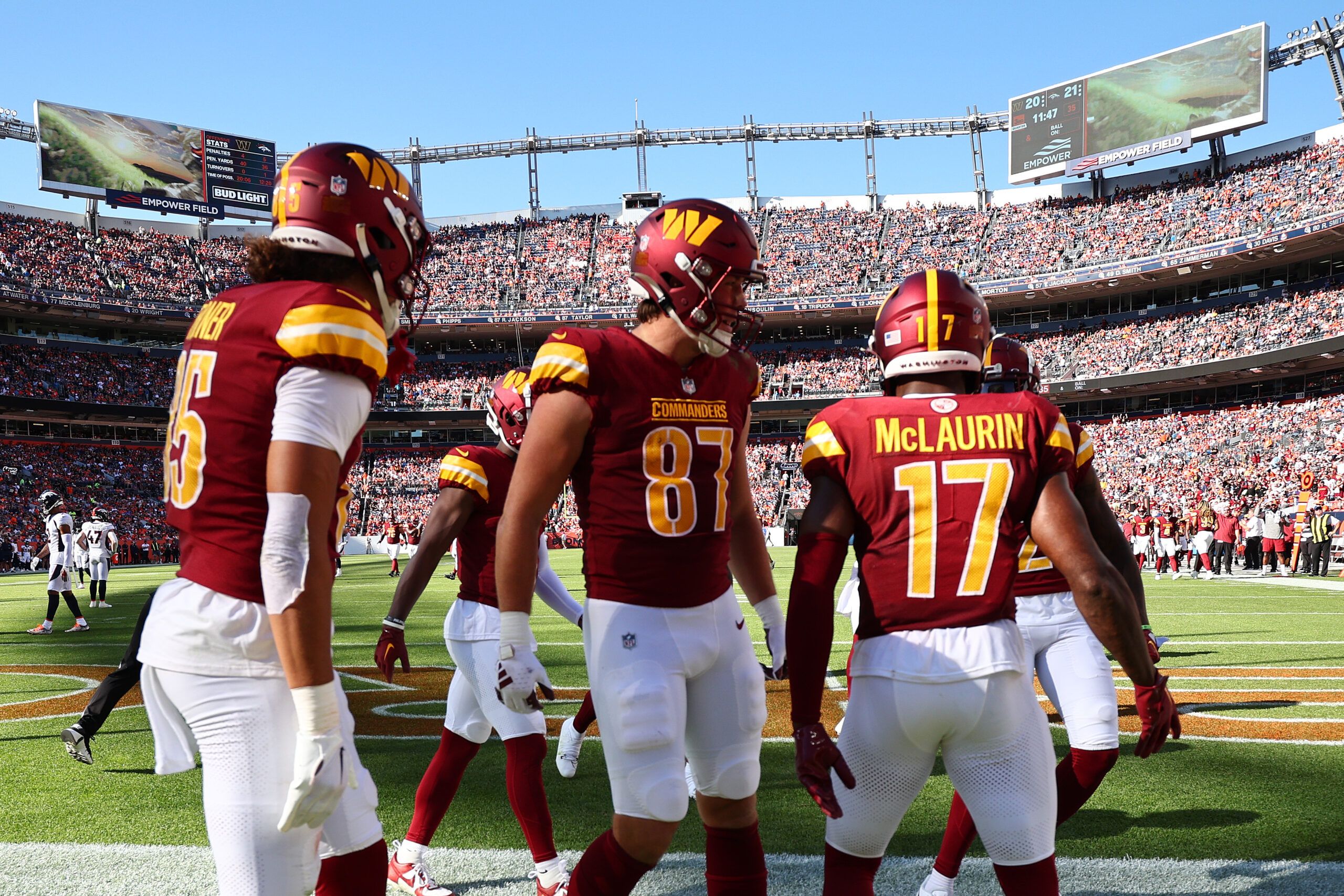 Brian Robinson Jr. #8 of the Washington Commanders celebrates