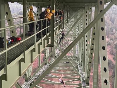 Teen, 19, gets stuck dangling from California’s highest bridge while filming stunt with friend
