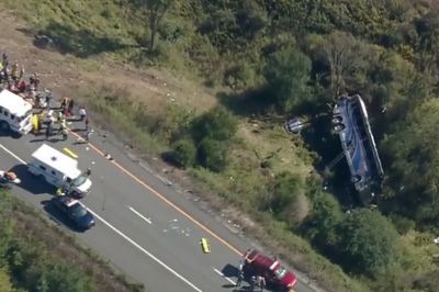 Bus carrying high school students to band camp crashes, killing 2 and seriously injuring others