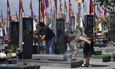 ‘I came to apologise’: Armenian relatives visit soldiers’ graves after ceasefire deal