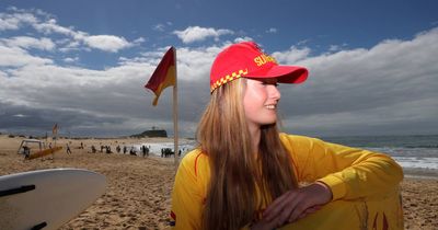 Red and yellow surf life saving flags raised on Nobbys Beach for bumper summer season