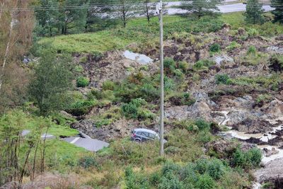 A landslide in Sweden causes a huge sinkhole on a highway and 3 are injured when cars crash