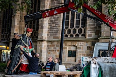 A statue of a late cardinal accused of sexual abuse has been removed from outside a German cathedral