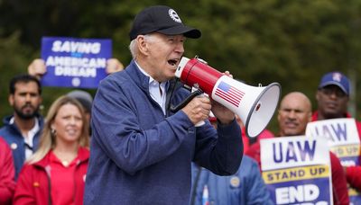 Biden joins picket line, urges striking autoworkers to ‘stick with it’