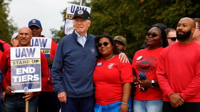 'Stick with it': Biden makes history by joining striking auto workers on the picket line