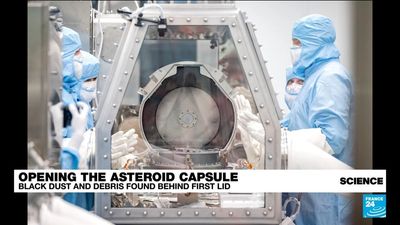 NASA opens asteroid capsule, finds dust and purges debris