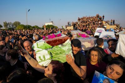 Iraq's prime minister visits wedding fire victims as 2 more people die from their injuries