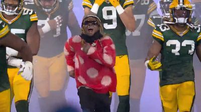 Green and Yellow: Packers Superfan Lil Wayne Leads Team Out of Tunnel Before Lions Game