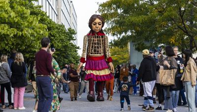 Hundreds welcome 12-foot tall Syrian refugee puppet Little Amal at Navy Pier: ‘It was very emotional’