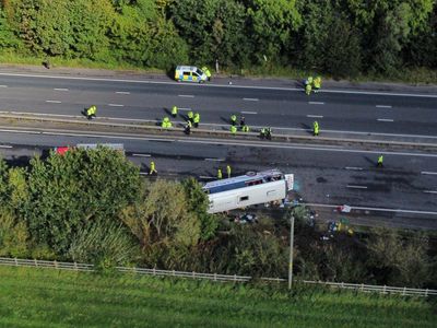 Girl, 15, and driver killed in M53 crash after school bus overturns