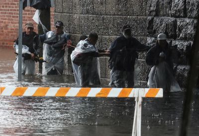 Storm pounds New York City area, flooding subways and leading to abandoned vehicles on the FDR Drive