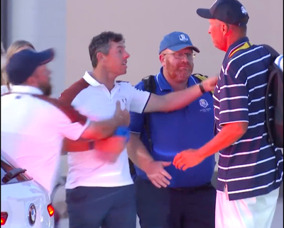 Rory McIlroy restrained by Shane Lowry after Ryder Cup argument with US caddie