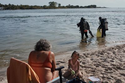 In New York City, scuba divers' passion for the sport becomes a mission to collect undersea litter