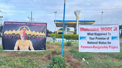 Posters criticising PM Modi appear as he arrives in Hyderabad