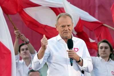 Polish opposition head Donald Tusk leads march to boost chances to unseat conservatives in election