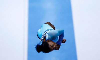 Biles maintains lead on second day of qualifications at world championships