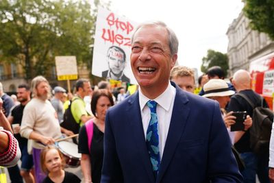 Nigel Farage reacts after Rishi Sunak leaves door open for his return to Tory party