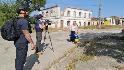 In a ghost town, Ukraine’s aid workers toil as Russian shells whizz above