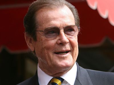 Roger Moore’s lookalike sons steal show at auction of Bond star’s belongings
