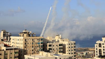 Israel says at 'war' after rocket barrages, militant infiltration