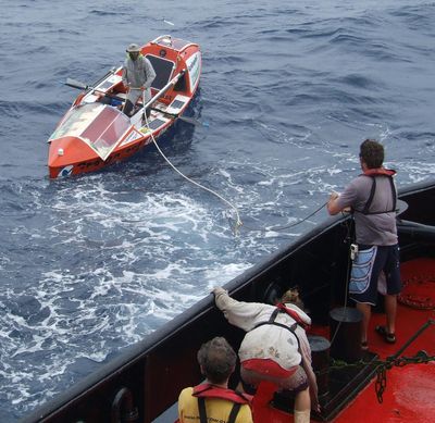 Australian adventurer on rowing expedition across Pacific Ocean rescued after homemade boat capsizes
