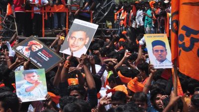 Unidentified men display Ghodse, Veer Savarkar images during Shobha Yatre in Chitradurga