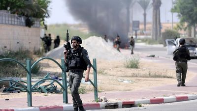 More than 100 bodies recovered from kibbutz as Hamas makes Israel hostages death threat