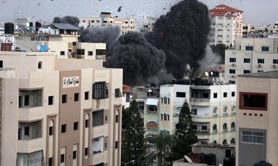 ‘Bombs are falling all around us’: fear in Gaza as Israel vows to tighten siege