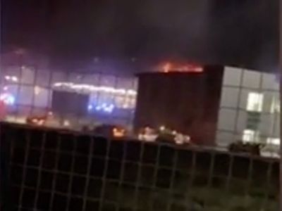Flights suspended at Luton Airport after fire engulfs car park
