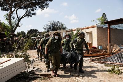 ‘Horrific scenes’ as dozens of bodies found in Israel’s Kfar Aza near Gaza