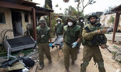 Hamas gunmen ‘killed families in their beds’ at Kfar Aza kibbutz, say Israeli forces