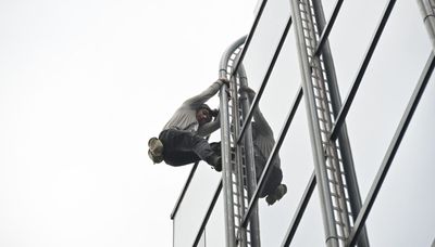 Charges filed against anti-abortion activist who climbed Accenture Tower without rope