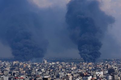 AP PHOTOS: Rockets sail and tanks roll in Israeli-Palestinian war's 5th day