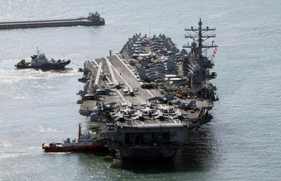 US aircraft carrier arrives in South Korea as North's leader Kim exchanges messages with Putin