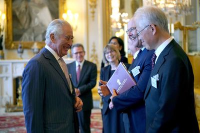 King in joyful spirit as he presents engineering prizes at Buckingham Palace