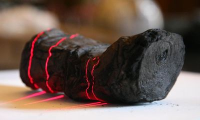 Researchers use AI to read word on ancient scroll burned by Vesuvius
