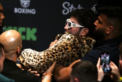 Dillon Danis hits Logan Paul in the head with microphone as face-off descends into chaos