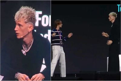 Machine Gun Kelly jumps to defend himself after fan rushes at him on stage