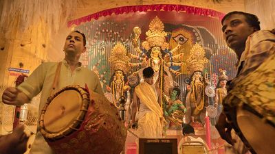 Explore Durga Puja pandals in Kolkata that have transitioned from traditional to high-tech art installations