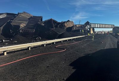 Semi-truck driver killed when Colorado train derails, spilling train cars and coal onto a highway