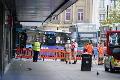 Bus crashes into Manchester city centre shop