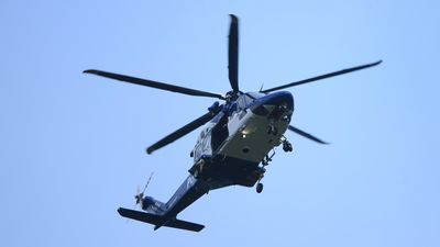 Men charged over shining a laser at police chopper