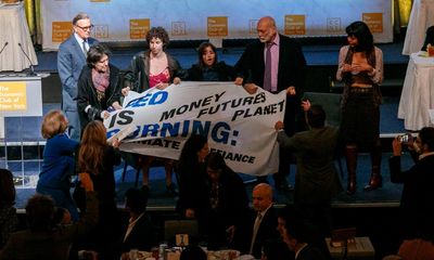 Climate activists force Fed chair Jerome Powell off stage in New York