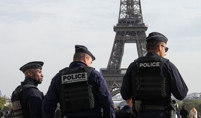 Stranded on the Eiffel Tower, a couple decide to wed, with an AP reporter there to tell the story