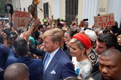 Dutch king and queen are confronted by angry protesters on visit to a slavery museum in South Africa