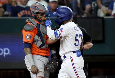 Adolis Garcia angrily confronts catcher Martin Maldonado, not the pitcher, in bench-clearing melee after hit by pitch