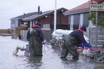 Gale-force winds and floods strike northern Europe, killing at least 3 in the U.K.